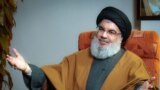 (FILES) A file handout picture obtained by AFP from the office of Iran's Supreme Leader Ayatollah Ali Khamenei on September 28, 2019, shows Lebanon's Hezbollah leader Hassan Nasrallah during what the office said was an "exclusive discussion" with members 